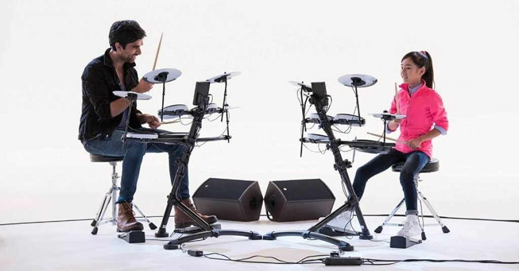 Man and girl play at Roland TD-1K Entry Level V-Drums Kit