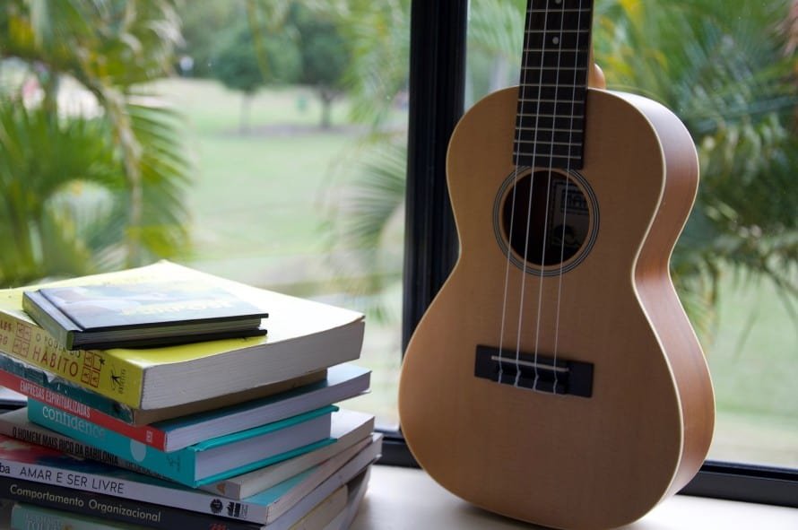 ukulele and a stack of books