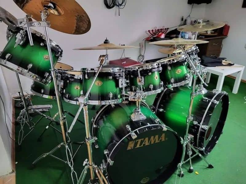 Green drum set in the room