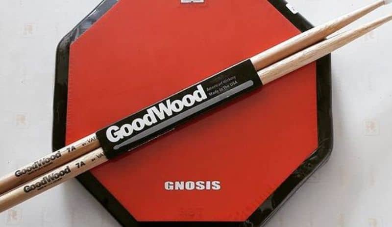 Set from 2 drumsticks and drum pad